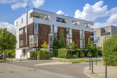 Germany, berlin, street in front of modern suburban row houses in new development area