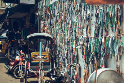 Bicycles parked against wall in city