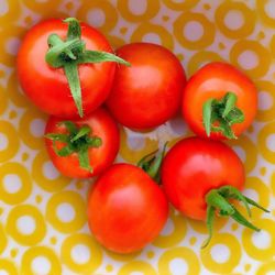 Directly above view of fresh cherry tomatoes on table