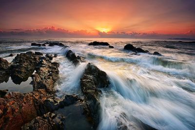 Scenic view of sea against sky during sunset