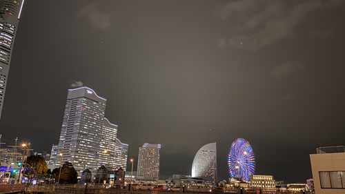 Illuminated buildings in city at night