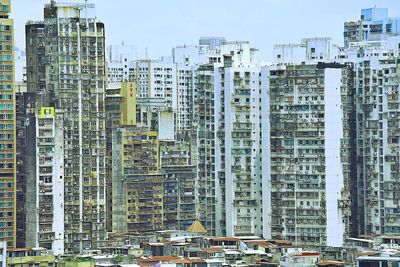 Buildings in city against sky