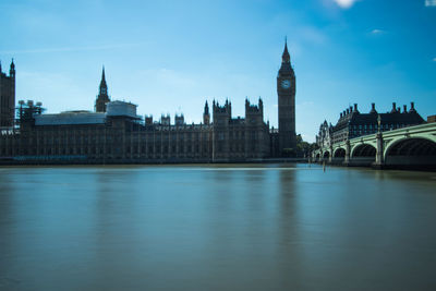 Bridge across river with government buildings in background