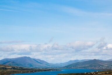 Scenic view of mountains against cloudy sky