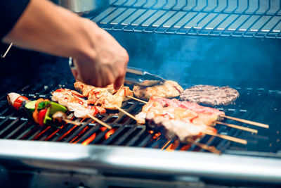 Close-up of meat on barbecue grill