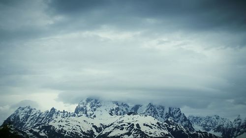 Scenic view of mountains against sky during winter