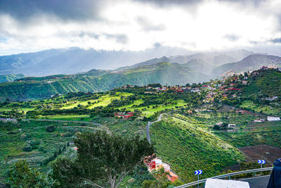 High angle view of plants and mountains against sky
