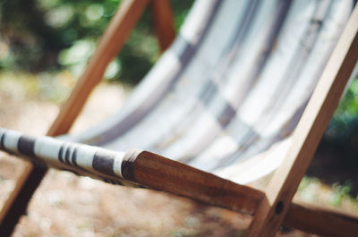 Close-up of deck chair on field