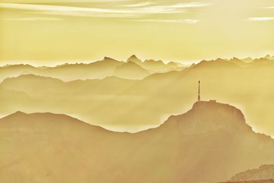 Scenic view of mountains against sky during sunset