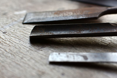 Close-up of tools on wooden table