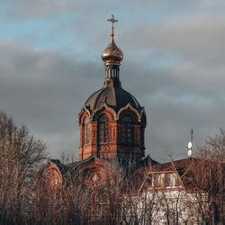 Cathedral by building against sky