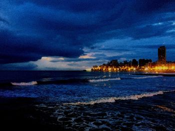 Scenic view of sea against sky at dusk