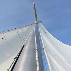 Low angle view of mast against blue sky