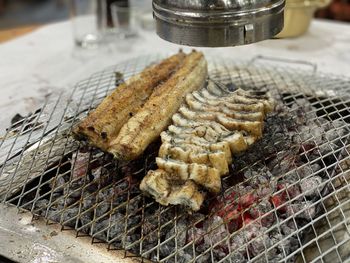 High angle view of meat on barbecue grill