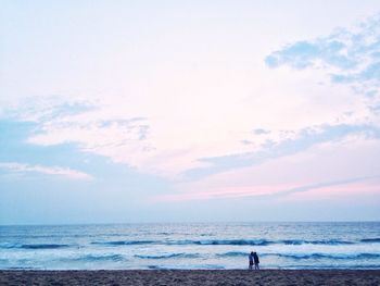 Scenic view of sea against cloudy sky