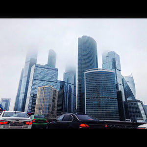 Modern buildings in city against sky