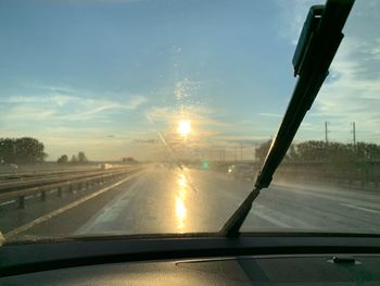 Road seen through car windshield