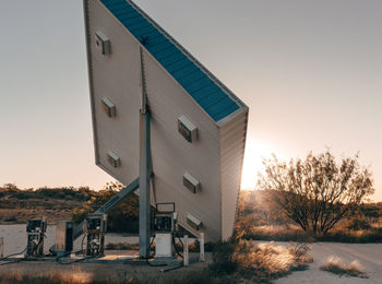 Fallen billboard against sky