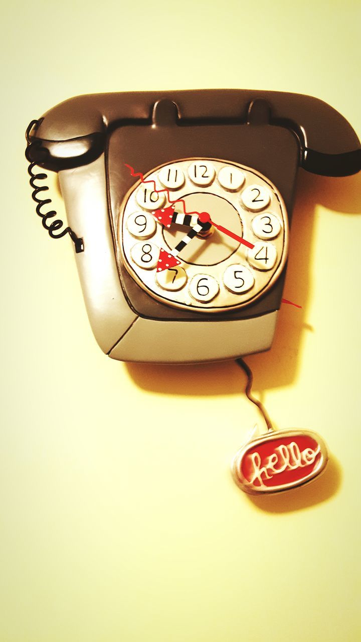 text, communication, indoors, number, time, close-up, western script, single object, clock, still life, studio shot, old-fashioned, white background, no people, circle, table, retro styled, instrument of measurement, technology, accuracy