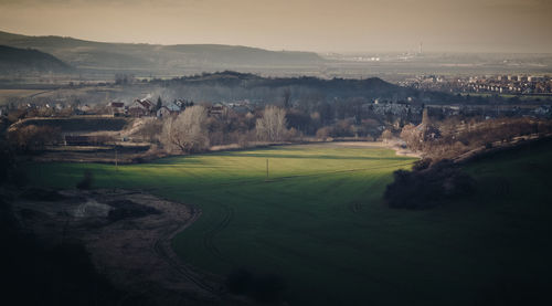 High angle view of golf course against sky