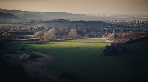 High angle view of golf course against sky