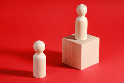 Close-up of chess pieces on yellow background