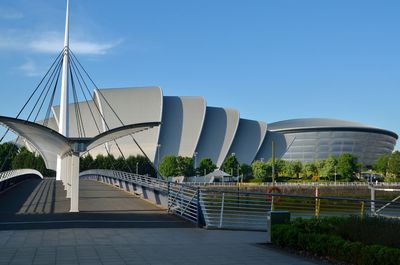 Bridge against clear blue sky in city