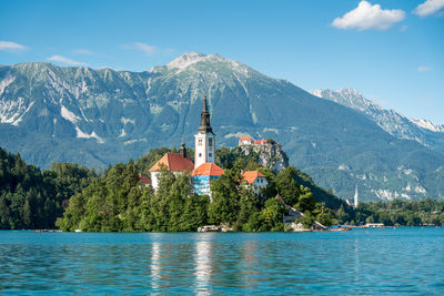 Scenic view of building and mountains against sky