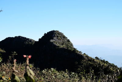 Scenic view of mountain against clear blue sky