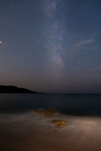 Scenic view of sea against sky at night