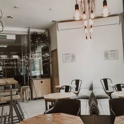 Empty chairs and tables against wall at home