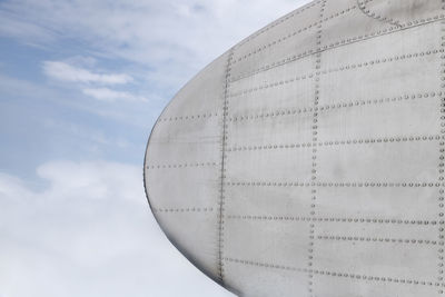 Cropped image of airplane against sky