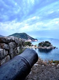 Scenic view of sea against cloudy sky