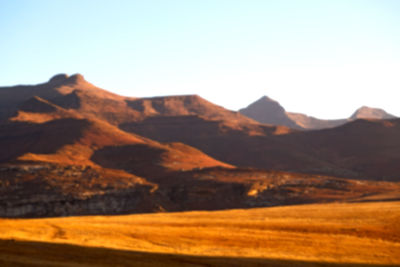 Scenic view of desert against clear sky