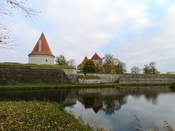 Reflection of building in lake against sky castle 