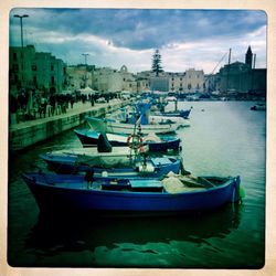 Boats moored at harbor