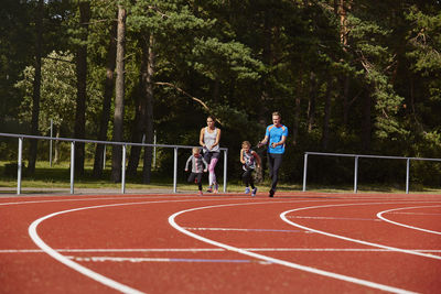 Group of people running in park