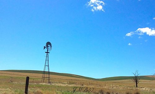 View of landscape against clear blue sky