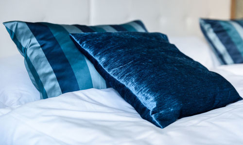 Close-up of pillow on bed at home