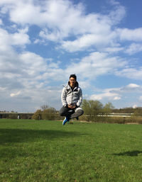 Man standing on grassy field