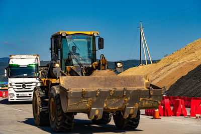 View of construction site against clear blue sky