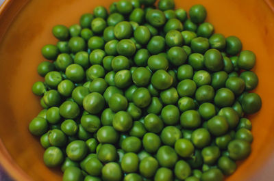 High angle view of green peas in bowl