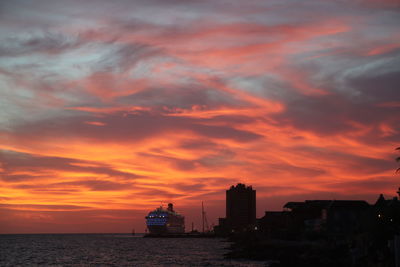 Scenic view of sea against romantic sky at sunset