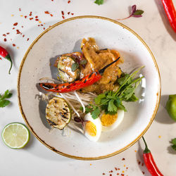 High angle view of fruits in plate on table