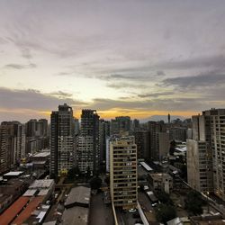 High angle view of buildings against sky during sunset