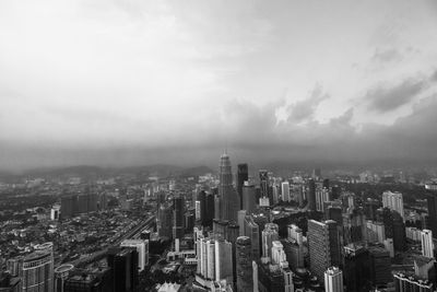 High angle view of modern buildings in city against sky