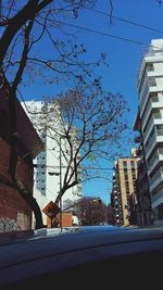 Low angle view of buildings against blue sky