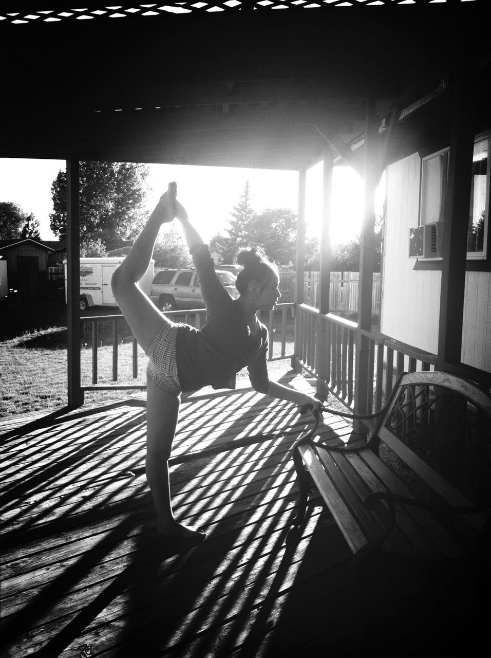 lifestyles, leisure activity, sunlight, full length, shadow, person, casual clothing, railing, rear view, standing, togetherness, tree, childhood, girls, relaxation, built structure, sitting