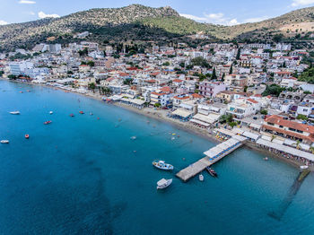 High angle view of townscape by sea