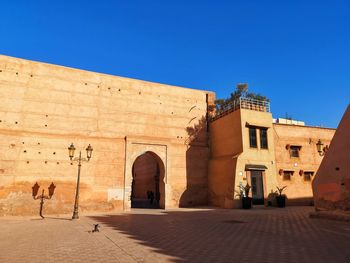 View of historical building against clear blue sky